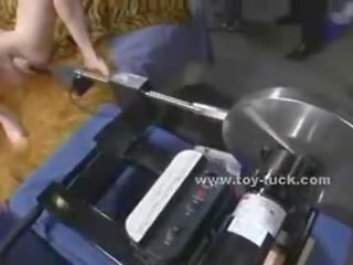 Blonde feature with small tits takes off her clothes and sets up testing fucking machines masturbating